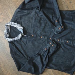 Men's black button up shirt with plaid accented collar and sleeves